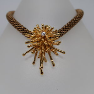 Pendentif “Eclats” bronze doré avec zircon