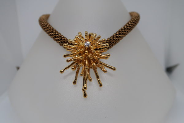 Pendentif “Eclats” bronze doré avec zircon